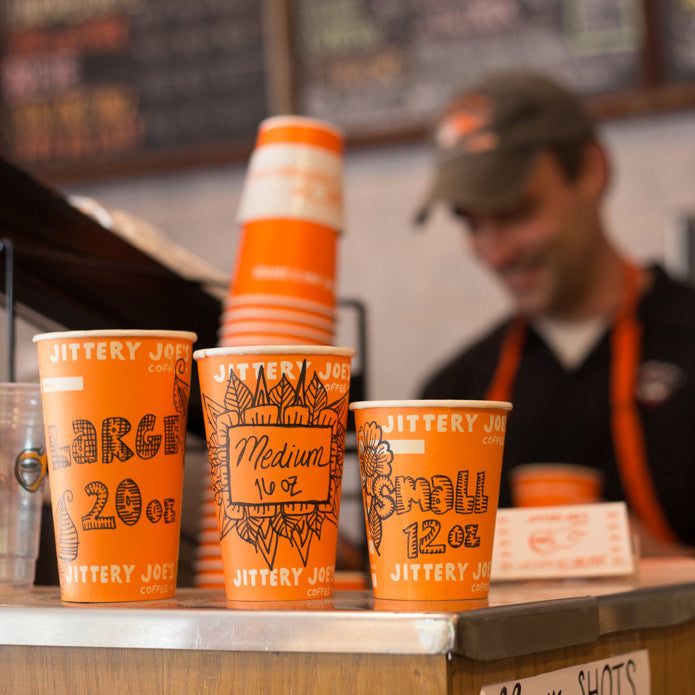 Jittery Joe's cups stacked.